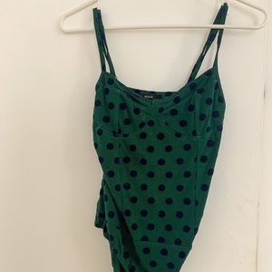 Green polkadot body suit
